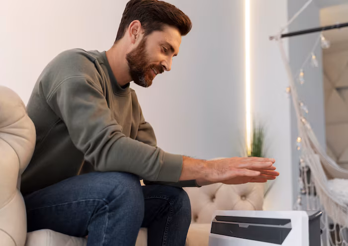 close-up-young-adult-getting-warm-by-heating-power-repair-team